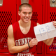 Grinnell’s Jack Taylor holding up the number of points he scored in a single game.